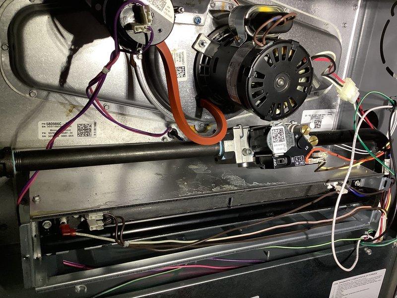 Completed annual maintenance on a one-year-old central HVAC system including both forced air furnace and air conditioning components. Performed comprehensive AC tune-up, inspected blower motor assembly and electrical connections, verified proper operation of all system components, checked wiring harnesses and motor housing, and confirmed air filter condition. System found to be operating within normal parameters with no deficiencies noted.