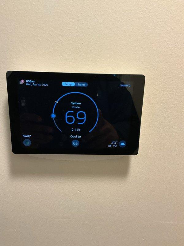 Completed scheduled Air Care Heating and Cooling maintenance on Lennox HVAC system. Verified thermostat operation showing system cooling to 65°F setpoint with current temperature at 69°F and external humidity at 36%. Performed electrical diagnostics using clamp meter, confirming proper amperage draw at 0.58A, indicating normal system operation and component functionality.