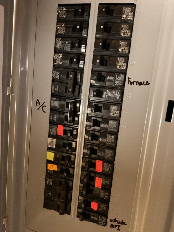 Completed installation of Lennox furnace and air conditioning system in residential basement location. Installed furnace on concrete pad with all necessary ductwork connections, including flexible metallic supply ducts, cylindrical metal distribution duct, and integrated humidifier system on ductwork. Connected white PVC condensate and vent piping, established electrical connections at main panel with dedicated circuits for A/C and furnace clearly labeled, and verified all mechanical and electrical systems operational. Air conditioning unit delivered to site pending final approval for side yard placement before exterior installation can be completed.