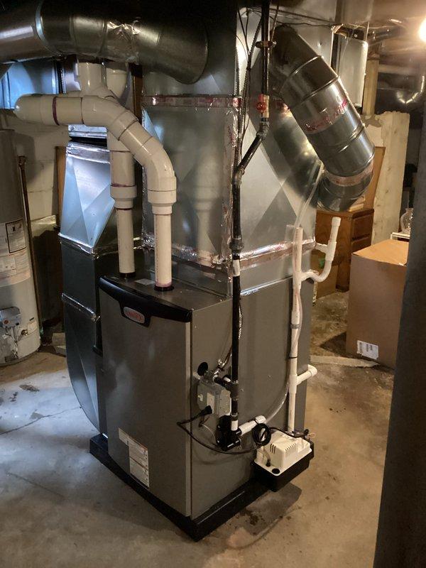 Completed installation of 90,000 BTU furnace and air conditioning system in basement mechanical room. Installed new furnace unit with proper ductwork connections, including metallic supply ducts routed throughout the structure and white PVC intake/exhaust venting. Connected all electrical components, secured ductwork with appropriate sealing, and positioned equipment on suitable platform. Mechanical and electrical permits were requested and obtained prior to installation. System was fully installed, tested, and commissioned for operation. All ductwork properly insulated and sealed to ensure efficient airflow distribution. Installation completed within scheduled timeframe with all components functioning to manufacturer specifications.