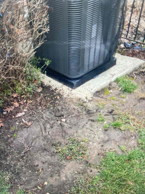 Completed installation of 70,000 BTU furnace and 2.5 ton air conditioning system in rear yard location with humidifier and reconnection of existing components. All necessary mechanical and electrical permits were obtained prior to installation. Condenser unit was positioned on rubber pad over concrete base; however, follow-up service is required to remove wooden support under pad and fill void beneath left side of condenser with pea stone to ensure proper leveling and drainage.