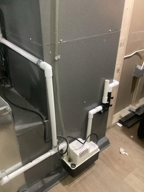 Responded to service call for 10-year-old basement air handler unit experiencing water leakage into basement and failure to operate. Upon inspection, diagnosed failed condensate pump causing water overflow from drain pan. Replaced defective condensate pump with new unit, verified proper drainage operation, and tested system startup sequence. Air handler now operating normally with no leaks detected.