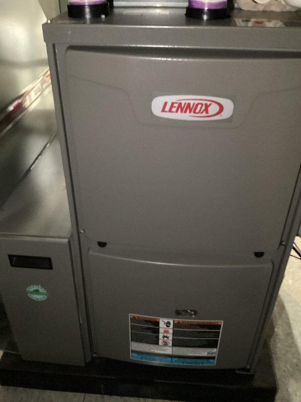 Completed scheduled Air Care Heating and Cooling maintenance on Lennox furnace unit. Performed comprehensive system inspection with access panel removed, examined blower motor assembly, gas valve components, ignition system, and draft inducer motor. All electrical connections, wire harnesses, and internal components verified for proper operation and safety compliance.