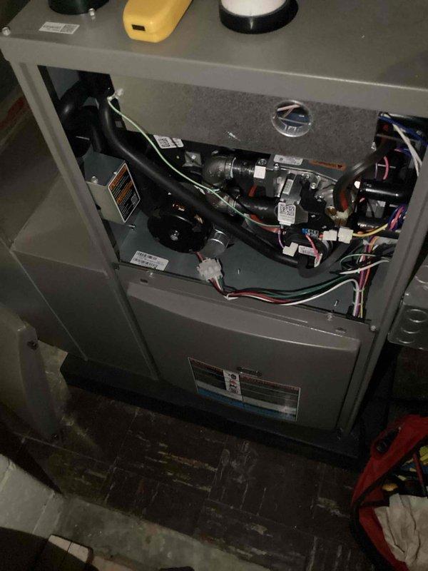 Completed scheduled Air Care Heating and Cooling maintenance on Lennox furnace unit. Performed comprehensive system inspection with access panel removed, examined blower motor assembly, gas valve components, ignition system, and draft inducer motor. All electrical connections, wire harnesses, and internal components verified for proper operation and safety compliance.