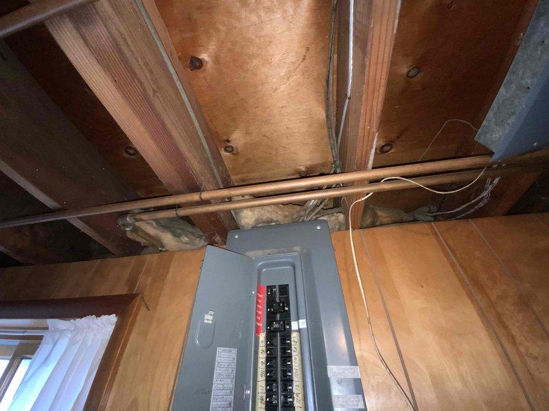 Conducted comprehensive site evaluation for mini split system installation at newly purchased residence with no existing cooling system. Assessed exterior wall mounting location near electrical meter and evaluated existing electrical panel capacity and available circuits for system connection. Documented installation requirements and confirmed homeowner preference for mini split solution over traditional central air conditioning system.