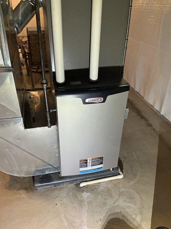 Completed comprehensive spring maintenance on a 3-year-old Lennox forced air furnace and air conditioning system. Performed AC tune-up including inspection of condenser unit, refrigerant levels, electrical connections, and blower motor assembly. Inspected furnace internal components, verified proper operation of inducer motor, examined wiring connections and safety controls, and confirmed venting system integrity through PVC exhaust pipes. All systems operating within normal parameters with no deficiencies noted.