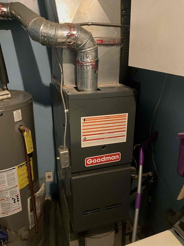 Completed full system estimate for replacement of existing HVAC equipment including 10-year-old Goodman furnace and 16-year-old air conditioning system. Inspected current installation in basement mechanical room, documented existing equipment configuration including furnace, ductwork connections, and plenum assembly. Photographed equipment to assess installation requirements and provided comprehensive quote for new furnace and AC system replacement, as customer's air conditioning unit barely functioned through previous cooling season and requires replacement within the month.