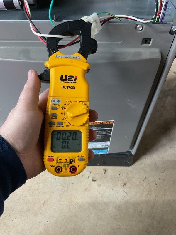 Performed complimentary maintenance on forced air furnace and air conditioning system. Conducted comprehensive AC tune-up including electrical diagnostics using digital multimeter to verify voltage readings at 216.2V and amperage draw measurements showing 0.0A on system components. Inspected all electrical connections, motor assembly, and internal cabinet components for proper operation. System found to be functioning correctly with no issues identified during inspection. All components tested within normal operating parameters.