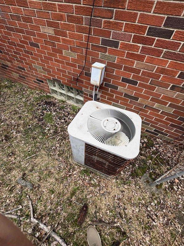 Completed full HVAC system estimate for residential property with 15-year-old air conditioning unit and furnace requiring evaluation. Assessed existing Goodman furnace installation in basement with current PVC condensate drainage and ventilation piping, along with connected ductwork and air handler components. Evaluated outdoor condensing unit positioned on exterior brick wall foundation, noting electrical disconnect and refrigerant line set configuration. Provided comprehensive replacement options for aging air conditioning system and repair recommendations for furnace to address homeowner's request for system upgrade within current season.