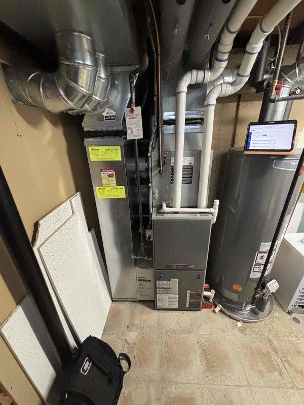 Completed estimate for replacement of 17-year-old natural gas furnace and air conditioning system located in basement. Current equipment still operational but nearing end of service life. Assessed existing HVAC installation, ductwork configuration, electrical service capacity at breaker panel, and available space for new equipment placement. Provided comprehensive replacement quote for matched furnace and AC system under promotional offer.