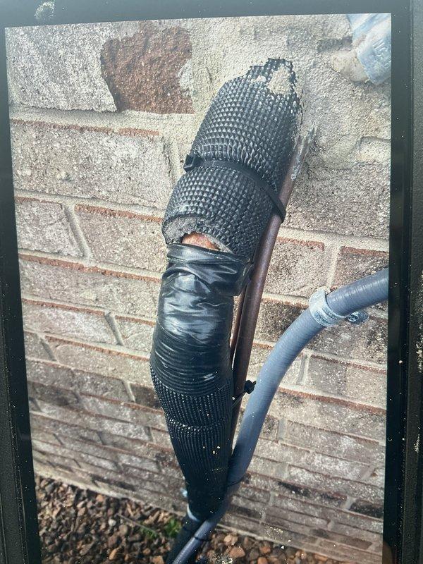 Completed installation of 3-ton air conditioning system with evaporator coil in rear yard location. Obtained mechanical, electrical, and AC permits prior to installation. Replaced defective 7/8" armor flex conduit at condenser unit, ensuring proper installation with butt-tight connection to building structure and seam positioned away from 90-degree bend, extending new armor flex directly to suction port. Secured all refrigerant lines with appropriate fasteners against brick exterior wall and completed system reconnection.