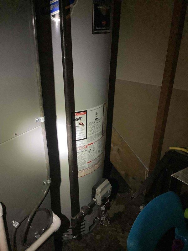 Conducted on-site evaluation for whole-house Generac generator installation at approximately 60-year-old residential property. Assessed existing electrical service panel configuration and capacity to determine appropriate generator sizing and transfer switch requirements. Documented current 120/240V split-phase electrical panel with standard circuit breaker arrangement. Evaluated mechanical room layout and available space adjacent to water heater and utility equipment for potential generator placement and fuel line routing. Photographed electrical panel labeling and circuit organization to calculate essential load requirements for automatic transfer switch specification. Inspection revealed adequate access for exterior generator pad installation and utility connections. Assessment complete for generator system proposal including unit sizing, transfer switch selection, and installation scope.