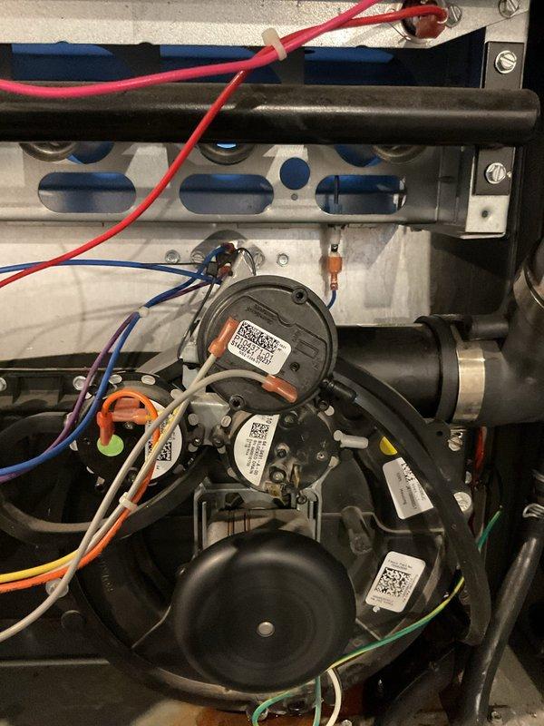 Installed temporary pressure switch on HVAC system to restore operation. Verified proper electrical connections to blower motor assembly and confirmed system functionality. Follow-up visit scheduled to install permanent pressure switch replacement (Part # L47714) and remove temporary component.
