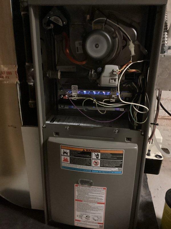 Completed comprehensive spring maintenance inspection on residential HVAC system under ComfortGuard Maintenance Package contract. Performed AC tune-up on 3-year-old central air conditioning system and inspected furnace unit. Accessed furnace cabinet to inspect blower motor assembly, control boards, electrical connections, and wiring harnesses; verified all LED indicators functioning properly and confirmed secure wire connections throughout internal compartment. Proceeded to outdoor condenser unit to complete cooling system maintenance, including inspection of compressor, condenser coil, fan assembly, and refrigerant service ports. Cleaned condenser coils, verified proper airflow through mesh grille, and tested fan motor operation. Checked refrigerant levels and system pressures at brass service ports. Confirmed both heating and cooling systems operating within manufacturer specifications with no deficiencies noted. All components functioning properly upon completion of scheduled mainte