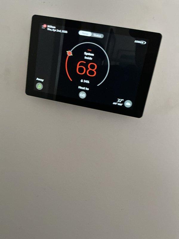 Completed routine HVAC maintenance on a one-year-old central air conditioning and furnace system. Performed comprehensive AC tune-up including inspection of air handler unit, verification of proper airflow through pleated air filter, examination of refrigerant lines and mounting brackets, and assessment of blower motor assembly. Confirmed digital thermostat operation and system functionality, with heating set to 68°F. All components operating within normal parameters with no deficiencies noted at time of service.
