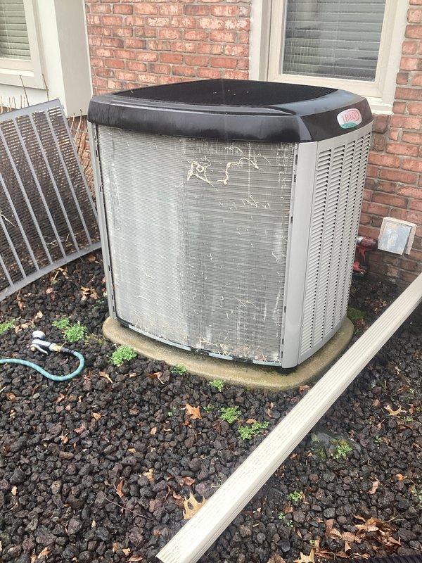 Completed annual Air Care Cooling maintenance on Trane condensing unit. Performed comprehensive system inspection, verified proper airflow through condenser coils and louvers, checked refrigerant lines and electrical connections, and confirmed unit operational status. Exterior components showed normal weathering with no significant concerns noted.