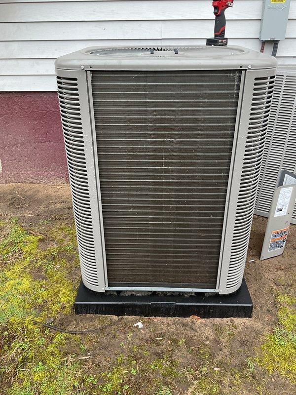 Performed spot check on outdoor air conditioning condenser unit. Inspected equipment exterior condition, verified proper mounting on pad, and assessed electrical components including amperage readings which measured 0.388 amps. Unit operational with no service requirements identified at this time.