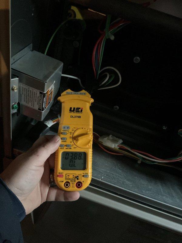 Performed spot check on outdoor air conditioning condenser unit. Inspected equipment exterior condition, verified proper mounting on pad, and assessed electrical components including amperage readings which measured 0.388 amps. Unit operational with no service requirements identified at this time.