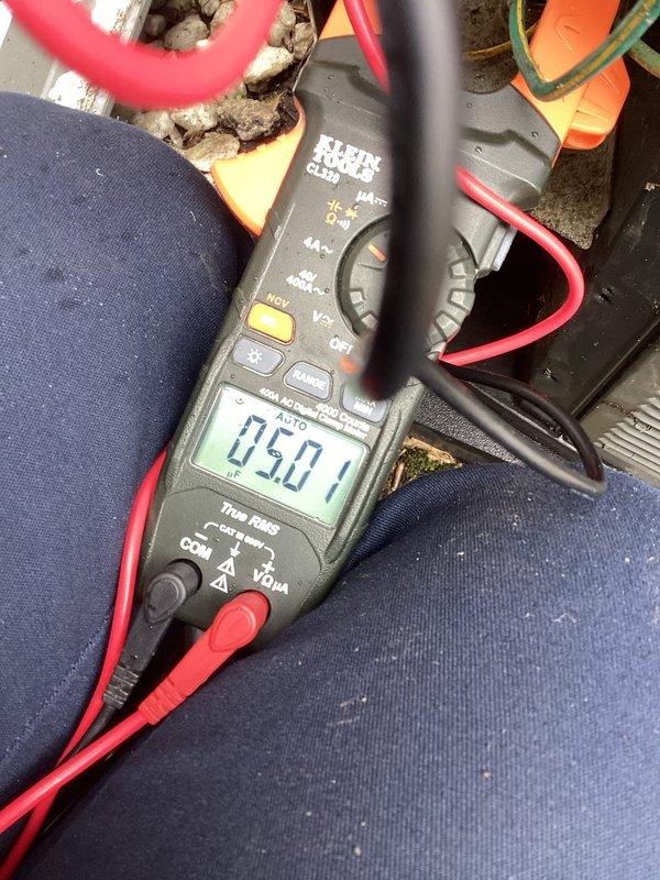Completed annual cooling maintenance on residential air conditioning system. Performed electrical diagnostics using clamp meter, recording compressor amperage draw of 5.0A and additional circuit measurements of 2.05A to verify proper system operation and component performance within manufacturer specifications.