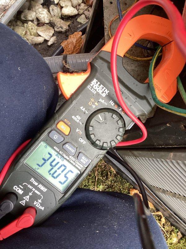 Completed annual cooling maintenance on residential air conditioning system. Performed electrical diagnostics using clamp meter, recording compressor amperage draw of 5.0A and additional circuit measurements of 2.05A to verify proper system operation and component performance within manufacturer specifications.