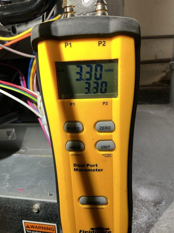 Responded to no heat call on 2018 furnace located in basement displaying fault code 274 for GF Primary Limit Switch Open. Upon arrival, verified thermostat was set to heat mode at 71°F but system was not operating. Performed diagnostic testing and measured gas pressure at 3.30" WC using dual port manometer to confirm proper gas supply to unit. Identified tripped primary limit switch preventing furnace operation. Inspected heat exchanger and airflow components to determine root cause of limit switch activation. Reset limit switch and cycled system to verify proper operation and heating. Unit restored to normal operation with adequate airflow and proper temperature rise across heat exchanger. Parts covered under warranty, labor not covered.