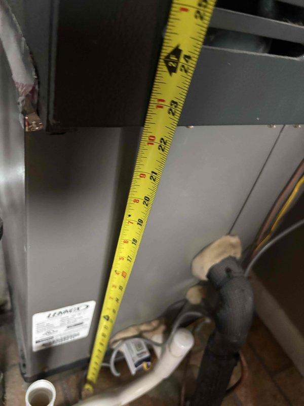 Provided estimate for replacement of 10-year-old Goodman natural gas furnace located in maintenance room. Current unit operational but customer seeking upgrade options. Evaluated existing installation including ductwork clearances, utility connections, and spatial requirements for new equipment installation in basement mechanical room alongside water heater.
