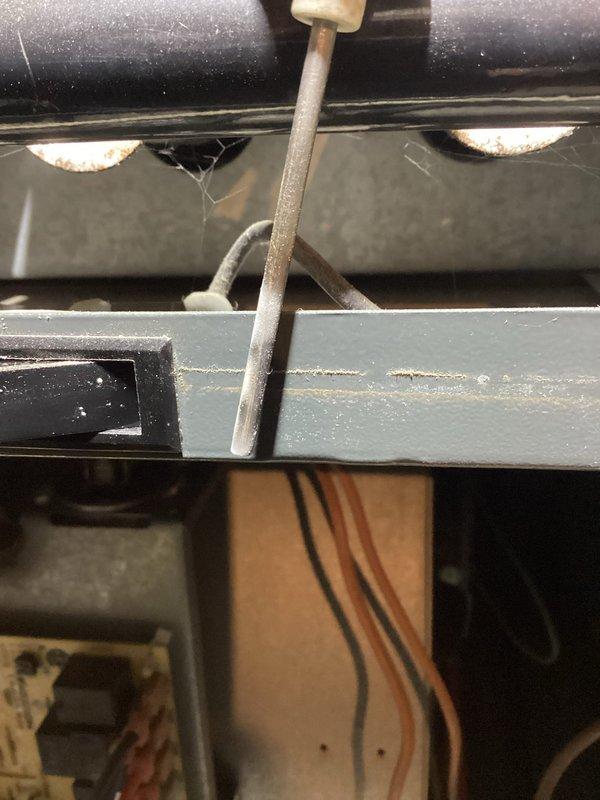 Responded to service call for furnace failing to reach set temperature and shutting off prematurely. Performed diagnostic inspection of basement-located gas furnace system, including visual examination of heat exchanger, burner assembly, and internal components. Utilized digital measuring instruments to assess system performance and temperature differentials across ductwork. Inspected flame sensor probe positioning and condition, checked all electrical connections and control wiring for proper operation. Evaluated airflow through supply ducts and verified proper venting. System assessed for potential issues related to limit switch operation, thermostat communication, or flame sensing malfunction causing premature shutdown cycles.