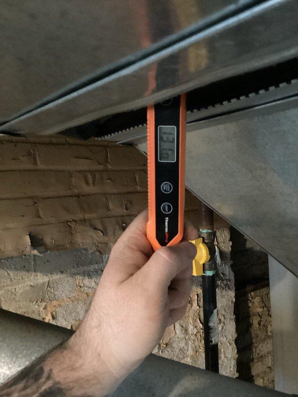 Responded to service call for furnace failing to reach set temperature and shutting off prematurely. Performed diagnostic inspection of basement-located gas furnace system, including visual examination of heat exchanger, burner assembly, and internal components. Utilized digital measuring instruments to assess system performance and temperature differentials across ductwork. Inspected flame sensor probe positioning and condition, checked all electrical connections and control wiring for proper operation. Evaluated airflow through supply ducts and verified proper venting. System assessed for potential issues related to limit switch operation, thermostat communication, or flame sensing malfunction causing premature shutdown cycles.