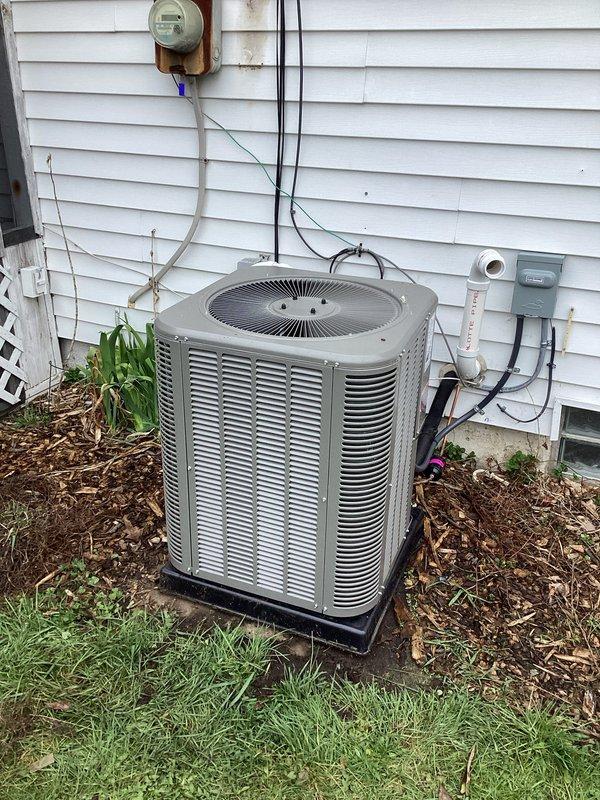 Completed full HVAC system installation including a 70,000 BTU furnace and 2-ton air conditioning unit with rear discharge configuration. Obtained mechanical and electrical permits prior to installation. Installed outdoor condenser unit on level platform with proper electrical disconnect and conduit routing along exterior siding. Connected all refrigerant lines, electrical wiring, and ductwork. Reconnected existing electrical service and verified proper system operation. All equipment labeled, secured, and tested for safe operation per manufacturer specifications and local code requirements.