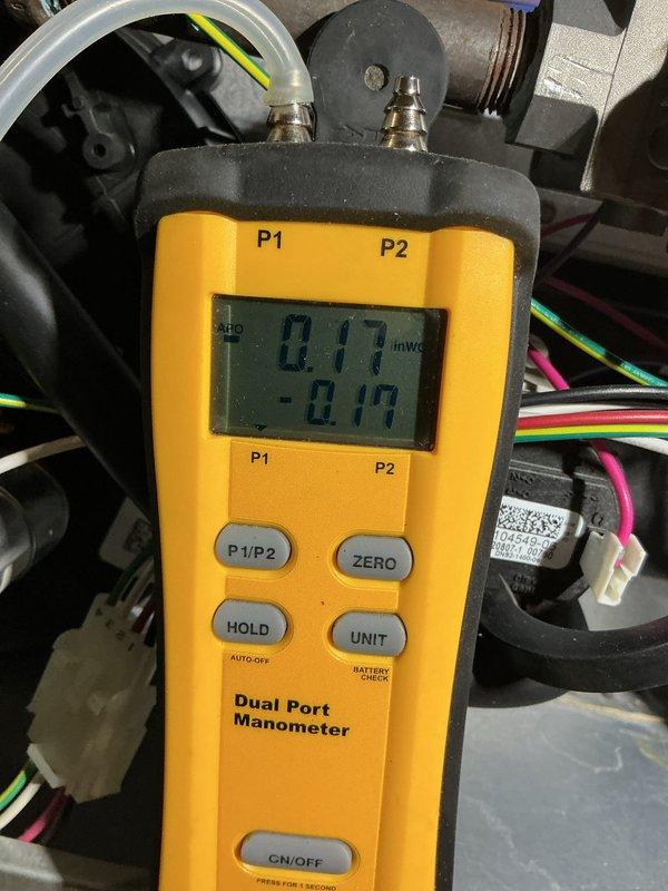 Completed annual maintenance on 15-year-old forced air heating and air conditioning systems. Performed comprehensive AC tune-up including pressure differential measurements using dual port manometer, inspected outdoor condenser unit with cylindrical housing and vertical louver vents, verified all electrical connections and components, and confirmed both heating and cooling systems are operating within normal parameters. All equipment tested and found to be functioning properly with no repairs required.