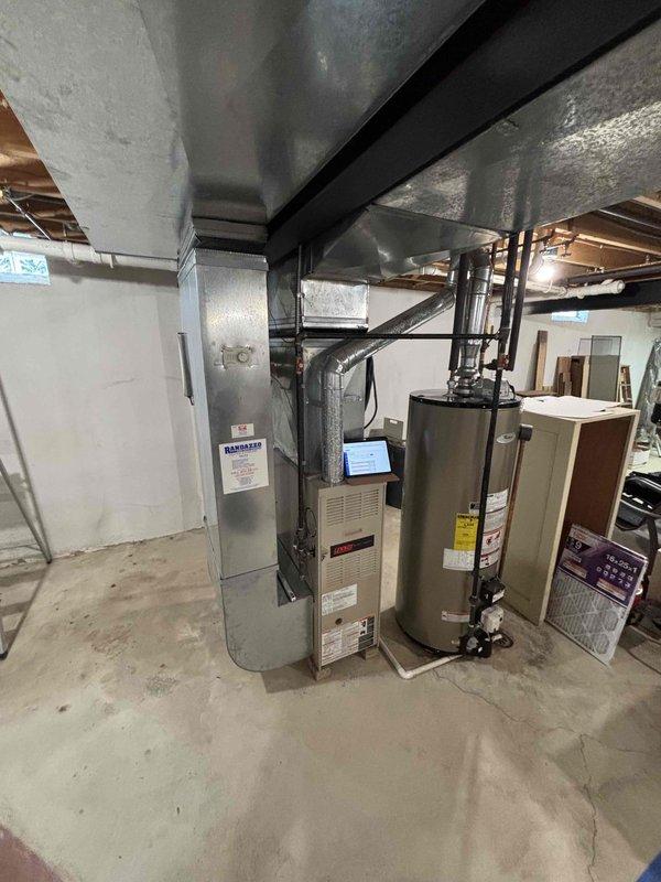 Completed comprehensive assessment for full HVAC system replacement on 26-year-old equipment including natural gas furnace located in basement mechanical room and outdoor air conditioning condenser unit positioned on concrete pad in backyard. Both units currently operational but at end of serviceable life expectancy. Provided estimate for complete system replacement including new furnace with ductwork connections and matching condenser unit to improve efficiency and reliability.