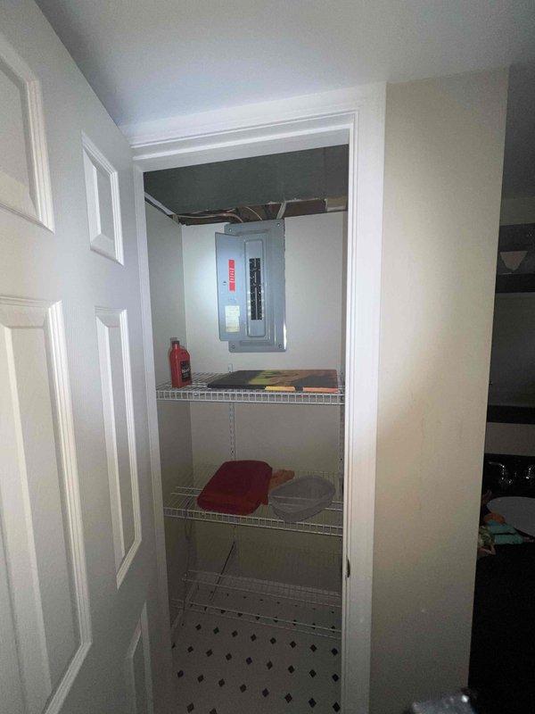 Conducted on-site assessment for air conditioning system replacement at residential property. Evaluated existing AC unit of unknown age, documented electrical panel location and accessibility in interior utility closet, and photographed installation area to determine equipment specifications and clearance requirements for new system installation. Provided comprehensive estimate for complete air conditioning unit replacement to be scheduled within requested timeframe.