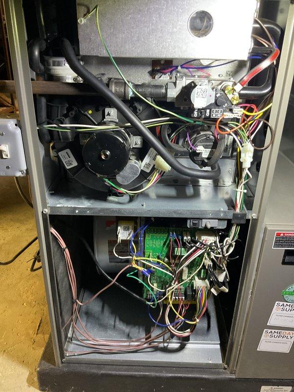 # HVAC Maintenance - AHC Completed

Performed comprehensive annual air conditioning tune-up on a brand new AC system as requested. Conducted thorough inspection of furnace interior components, including inducer motor assembly, electrical connections, and main control board. Verified all wire harnesses, relays, and control modules were properly secured and functioning. Performed electrical diagnostics using digital multimeter to measure system voltage and amperage, confirming readings within manufacturer specifications at 2.57V with proper current draw. Inspected all colored wire connections throughout electrical compartments for secure terminations and proper routing. Verified all warning labels and informational stickers were legible and in place. System found to be operating within normal parameters with no deficiencies noted. All components intact and functional, ready for cooling season operation.