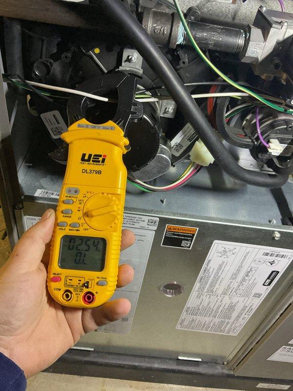 # HVAC Maintenance - AHC Completed

Performed comprehensive annual air conditioning tune-up on a brand new AC system as requested. Conducted thorough inspection of furnace interior components, including inducer motor assembly, electrical connections, and main control board. Verified all wire harnesses, relays, and control modules were properly secured and functioning. Performed electrical diagnostics using digital multimeter to measure system voltage and amperage, confirming readings within manufacturer specifications at 2.57V with proper current draw. Inspected all colored wire connections throughout electrical compartments for secure terminations and proper routing. Verified all warning labels and informational stickers were legible and in place. System found to be operating within normal parameters with no deficiencies noted. All components intact and functional, ready for cooling season operation.