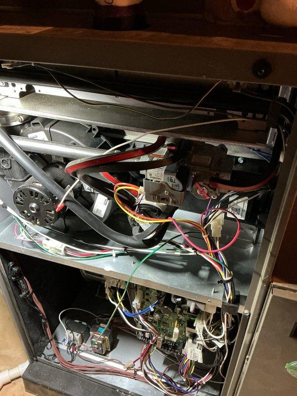 Completed scheduled air handler maintenance service. Accessed interior compartments by removing front panels to perform comprehensive system inspection. Replaced air filter (part #6673) and verified all electrical connections, control boards, and wiring harnesses were secure throughout upper and lower compartments. Inspected blower motor assembly, capacitor, refrigerant lines, and all mechanical components for proper operation and wear. All systems tested and confirmed operational within normal parameters.