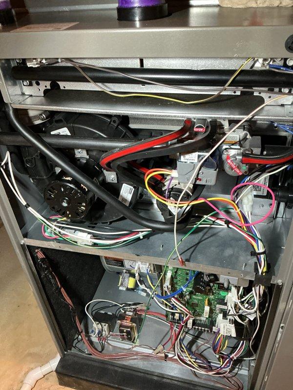 Completed scheduled air handler maintenance service. Accessed interior compartments by removing front panels to perform comprehensive system inspection. Replaced air filter (part #6673) and verified all electrical connections, control boards, and wiring harnesses were secure throughout upper and lower compartments. Inspected blower motor assembly, capacitor, refrigerant lines, and all mechanical components for proper operation and wear. All systems tested and confirmed operational within normal parameters.