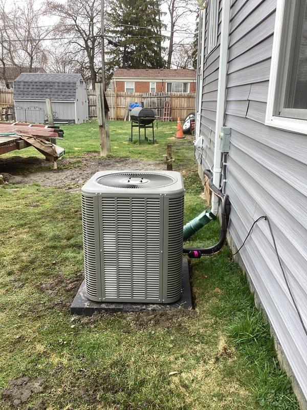 Completed full HVAC system installation including a 70,000 BTU downflow furnace and 2-ton air conditioning unit with rear discharge configuration. Installed new Lennox outdoor condenser unit on concrete pad with proper refrigerant line sets, electrical disconnect, condensate drainage, and PVC piping connections. Ran new dedicated electrical circuit to support system requirements and obtained mechanical and electrical permits prior to installation.