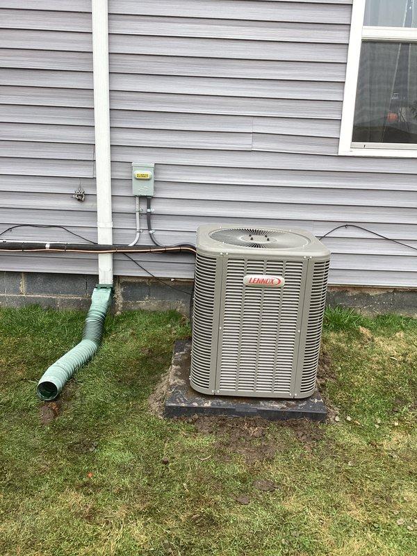 Completed full HVAC system installation including a 70,000 BTU downflow furnace and 2-ton air conditioning unit with rear discharge configuration. Installed new Lennox outdoor condenser unit on concrete pad with proper refrigerant line sets, electrical disconnect, condensate drainage, and PVC piping connections. Ran new dedicated electrical circuit to support system requirements and obtained mechanical and electrical permits prior to installation.