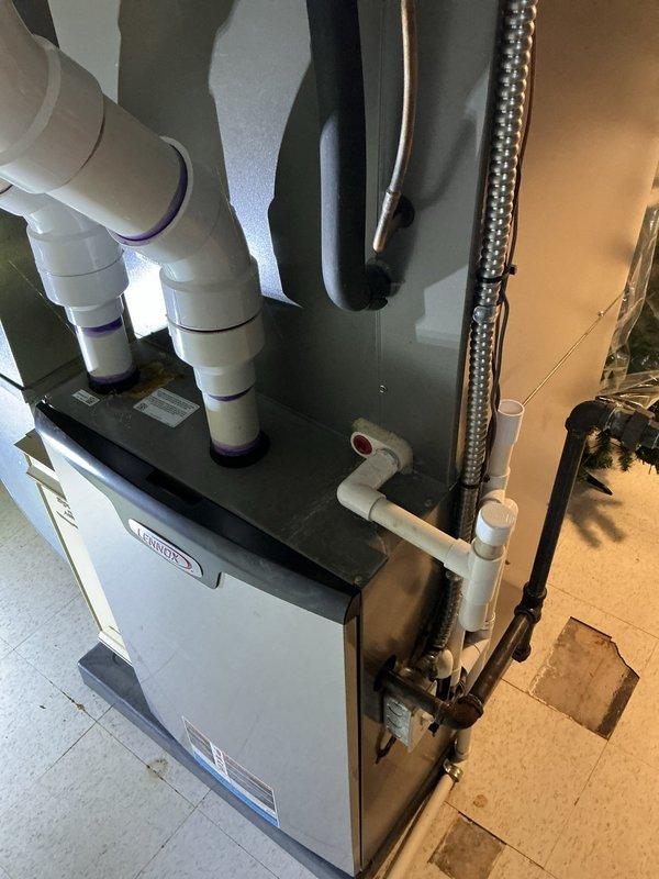 Completed annual preventive maintenance on residential gas furnace system. Performed comprehensive inspection of heating unit, verified proper operation of contactor and electrical connections, checked all safety controls and limit switches, inspected PVC intake and exhaust venting for proper installation and secure connections, examined refrigerant lines and ductwork connections, tested thermostat operation, and confirmed furnace cycling and flame characteristics are within manufacturer specifications. All components found operating properly with no deficiencies noted.