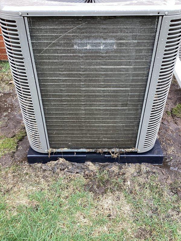 Performed routine Air Care Maintenance on outdoor condensing unit. Thoroughly cleaned heavily soiled condenser coil that exhibited significant accumulation of dirt, dust, and debris throughout the fin surfaces. Inspected unit housing, louvers, and base pan, confirming structural integrity and proper positioning on pad.