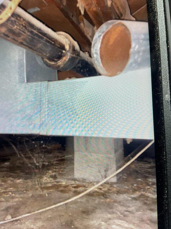 Responded to service call for heating system unable to enter second stage operation. Upon inspection, determined inadequate airflow (CFM) was preventing unit from staging properly. System is configured as downflow installation located in confined closet space with supply plenum extending into crawl space. Assessed restrictive installation conditions limiting proper airflow delivery. Documented existing ductwork configuration and clearance constraints. Provided customer with recommendations for increasing airflow capacity to enable proper two-stage heating operation.