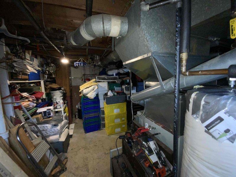 Provided comprehensive estimate for replacement of 24-year-old natural gas furnace and air conditioning system located in basement under buy-one-get-one promotional program. Current equipment remains operational but has reached end of expected service life. Assessment included evaluation of existing ductwork configuration, venting system, and spatial requirements for new installation in densely packed utility area with existing HVAC infrastructure and storage.