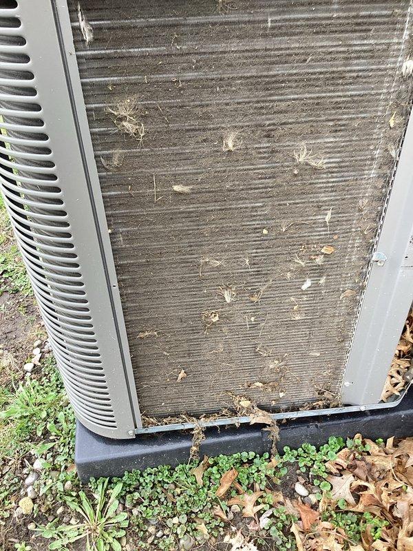 Completed annual maintenance on a 3-year-old residential central air conditioning system as part of year-end warranty compliance. Performed comprehensive AC tune-up including inspection of condenser unit, which showed significant accumulation of dirt, dust, and organic debris on condenser fins and coils. Cleaned condenser coils to restore proper airflow and heat transfer efficiency, removed leaves and vegetation debris from unit exterior and surrounding base area. Inspected refrigerant lines, electrical connections, and disconnect box for proper operation. Verified system operational parameters and confirmed all components functioning within manufacturer specifications with no issues identified.