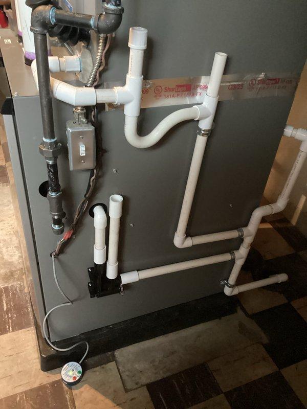 Completed full HVAC system installation including 70,000 BTU furnace and 2.5 ton air conditioning unit with rear discharge configuration. Installed complete PVC drainage and condensate system with proper pitch and connections, black iron gas piping with shutoff valve, flexible gas connector, and electrical connections with junction box. Reconnected existing humidifier to new system and mounted all equipment on appropriate drain pan in basement utility area. All mechanical, electrical, and furnace permits obtained and installation performed to code specifications.