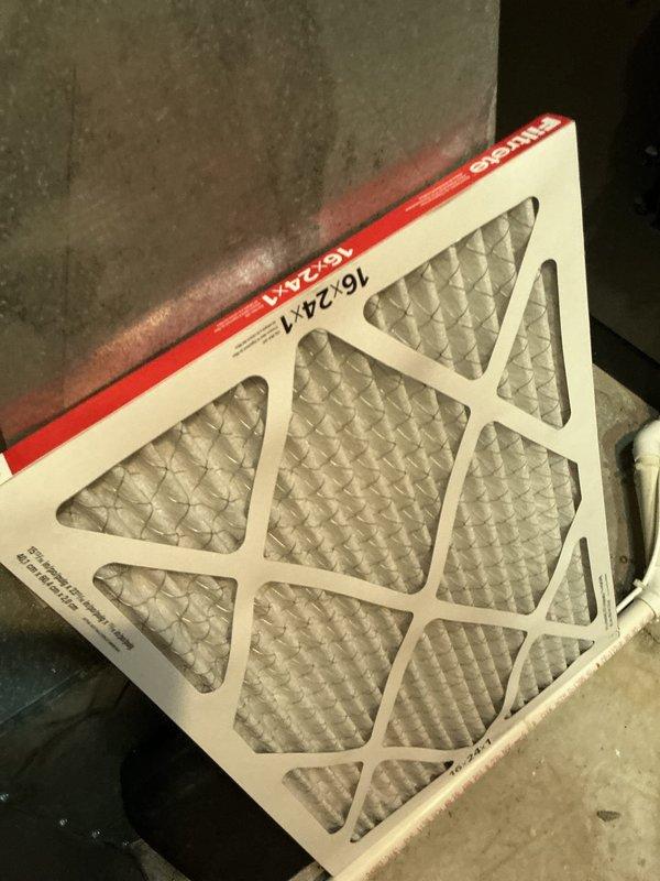 Completed annual cooling maintenance on residential HVAC system. Inspected 16x24x1 air filter which was found to be in clean condition and did not require replacement. Verified thermostat operation showing proper temperature control with system maintaining 70°F and setpoint at 63°F, confirmed Priority mode functionality and calibration of Honeywell Home unit.