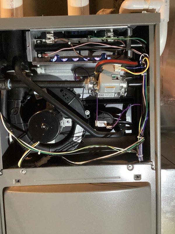 Completed comprehensive Air Care Heating and Cooling maintenance service on residential HVAC system. Accessed furnace unit, inspected internal components including blower motor assembly, gas valve, burner assembly with flame sensors, electrical connections, and control boards. Evaluated all wiring harnesses, condensate drainage lines, and pressure sensing tubes for proper operation. Checked furnace filter condition and replaced as needed to ensure optimal airflow and system efficiency.