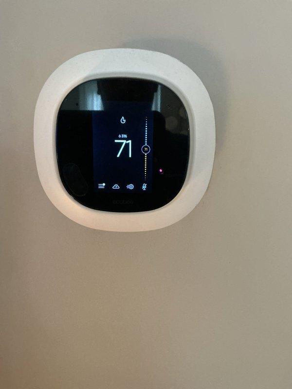 Completed comprehensive AC tune-up and preventive maintenance on a 5-year-old forced air heating and cooling system. Inspected and tested all major components including compressor, condenser coil, evaporator assembly, and electrical connections. Verified capacitor operation and checked refrigerant levels. Calibrated digital thermostat displaying proper temperature control at 71 degrees in heating mode. All systems operating within manufacturer specifications with no deficiencies noted.