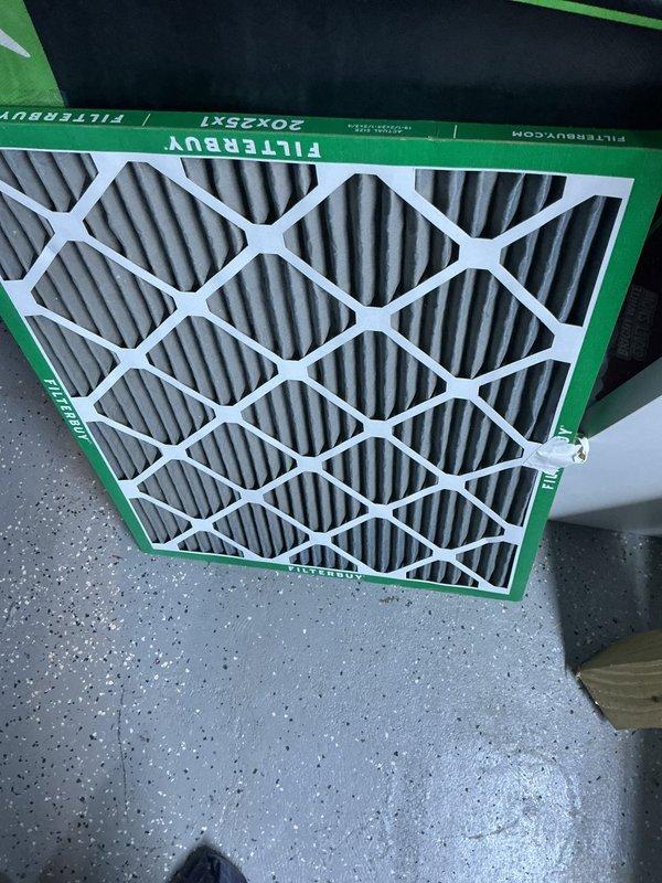 Completed scheduled air conditioning maintenance on residential split system unit. Inspected evaporator coil assembly, confirmed clean condition with proper fin spacing and no debris accumulation. Replaced 20x25x1 pleated air filter with new Filteruy unit to maintain optimal airflow and system efficiency.