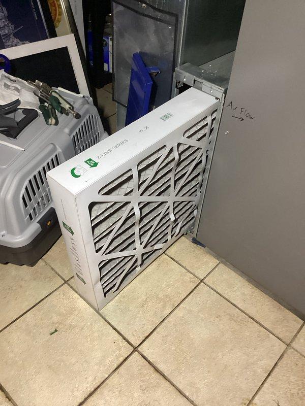 Completed fall preventative maintenance on residential air conditioning system. Inspected outdoor condensing unit, verified operational status of compressor and fan motor, and checked refrigerant levels. Evaluated indoor air filtration system, confirmed proper filter installation and airflow, and documented filter status indicator showing normal operation.