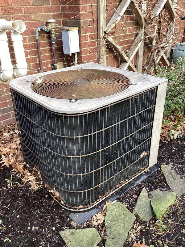 Completed fall preventative maintenance on residential air conditioning system. Inspected outdoor condensing unit, verified operational status of compressor and fan motor, and checked refrigerant levels. Evaluated indoor air filtration system, confirmed proper filter installation and airflow, and documented filter status indicator showing normal operation.